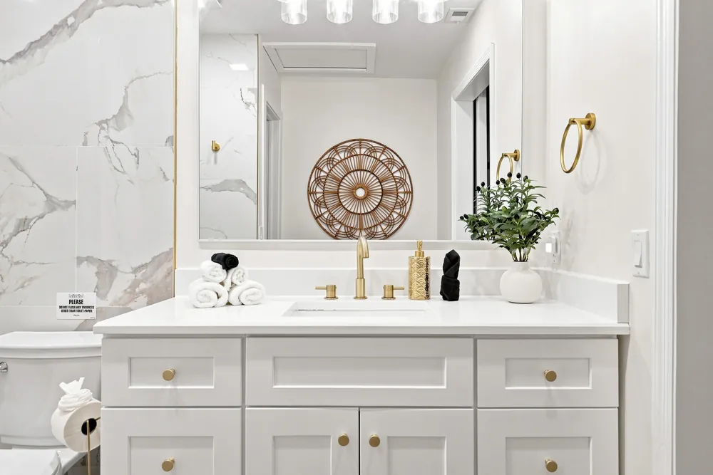 Marble vanity with brass fixtures