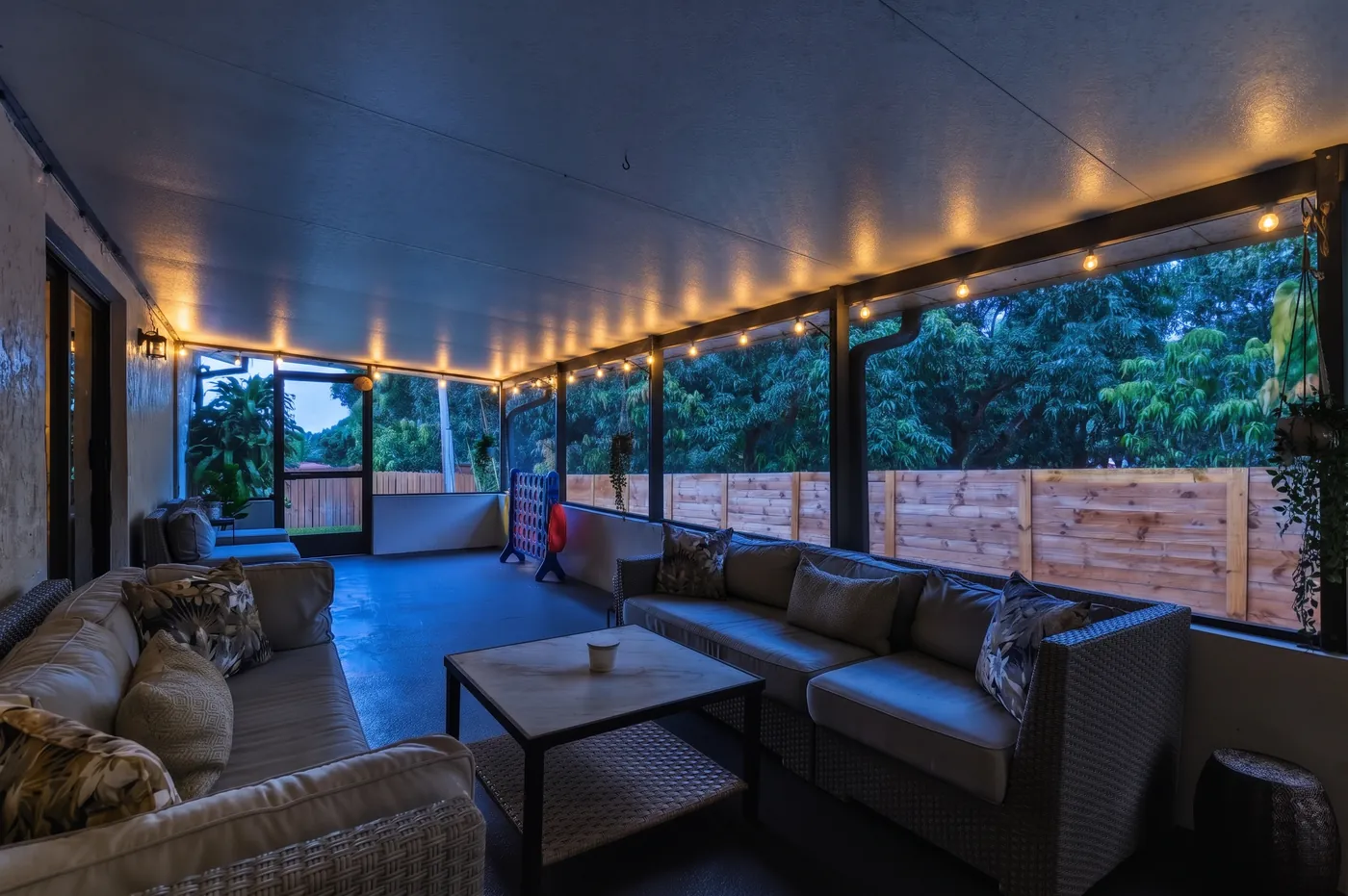 Screened lanai lit up at night